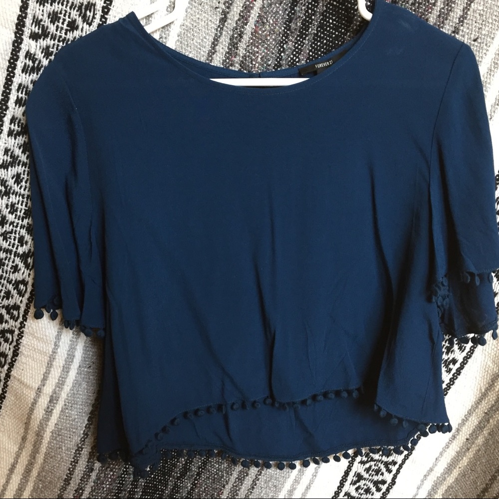 Dark blue blouse with circle tassels at the bottom